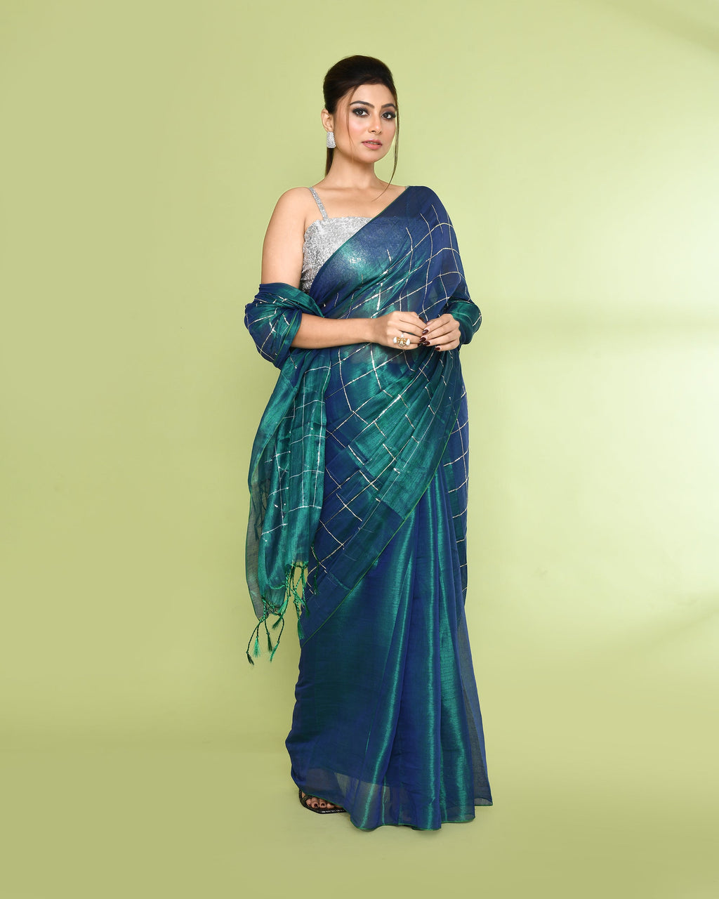 Blue green dual-tone tissue saree with sequin work and zari details