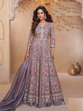 A stunning purple shimmer Indowestern wedding gown worn by a woman for formal events.