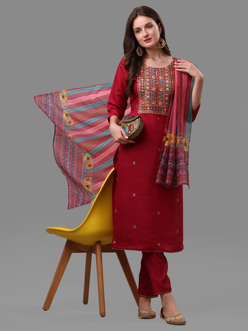 Fuchisia embroidered kurta paired with matching pants and a dupatta in lightweight rayon fabric