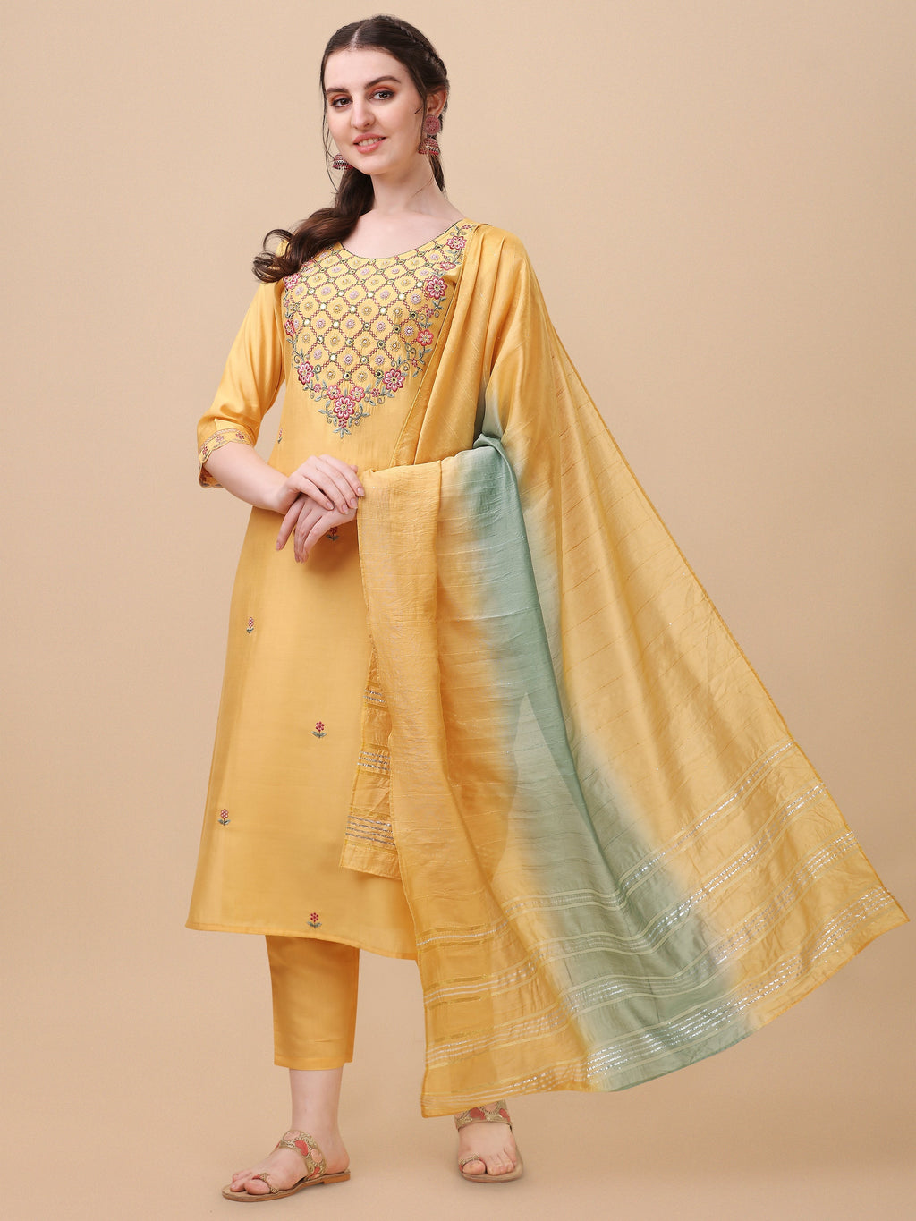Model wearing a vibrant multicolor rayon embroidered kurta set with matching pants and dupatta.