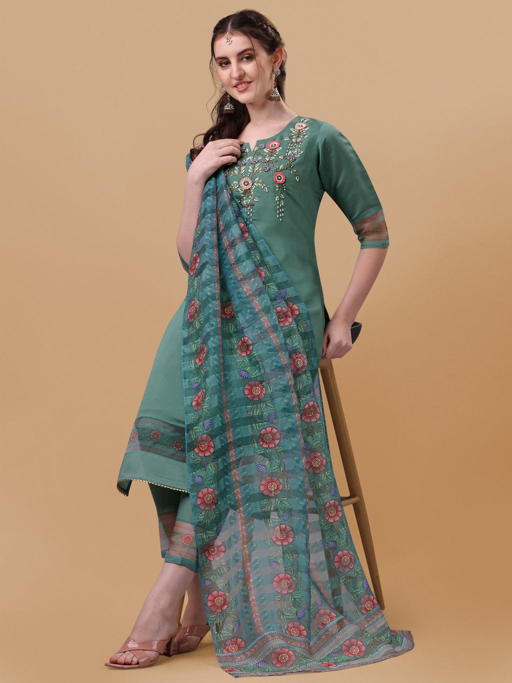 Model wearing a multicolor hand embroidered rayon kurta set with pant and matching dupatta