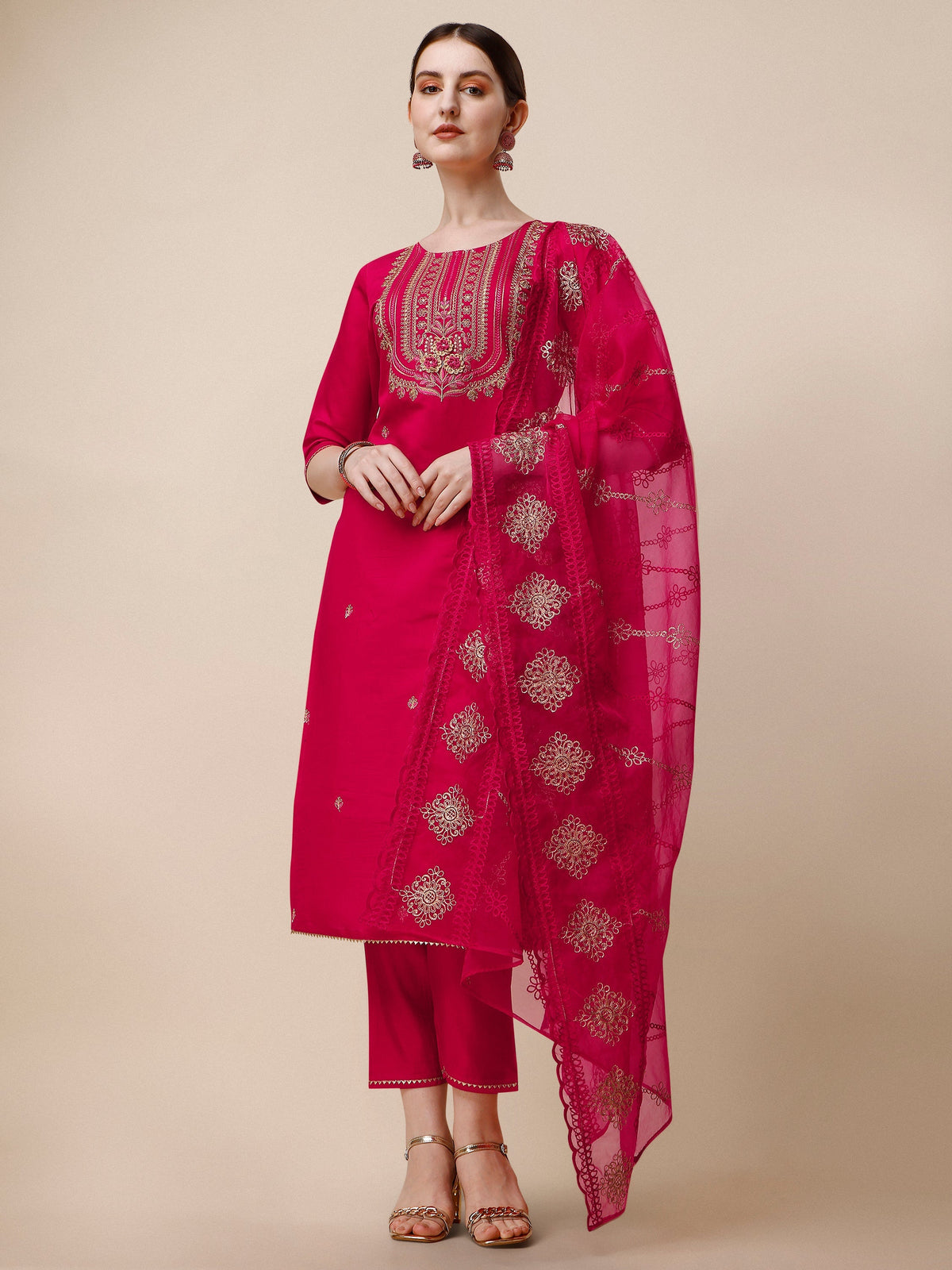 A woman wearing a multicolor embroidered rayon kurta set with matching pants and a dupatta.