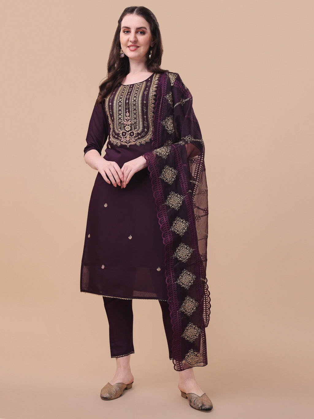 Multicolor embroidered kurta paired with pants and a matching dupatta.