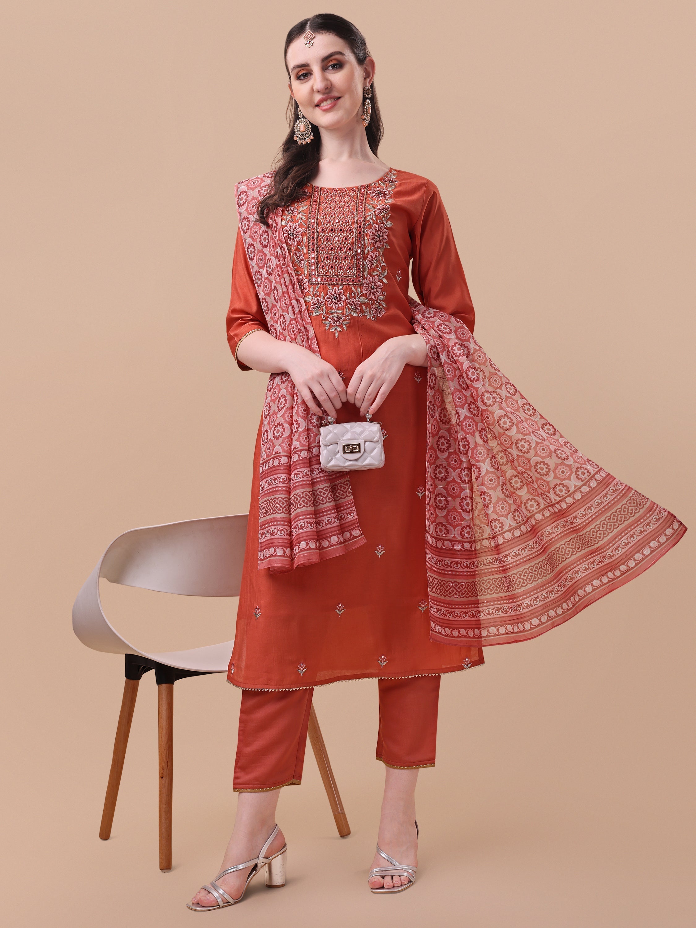 Woman wearing a multicolor embroidered rayon kurta with matching pants and a printed dupatta