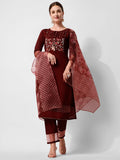 Woman wearing a multicolor hand embroidered rayon kurta set with matching pants and dupatta