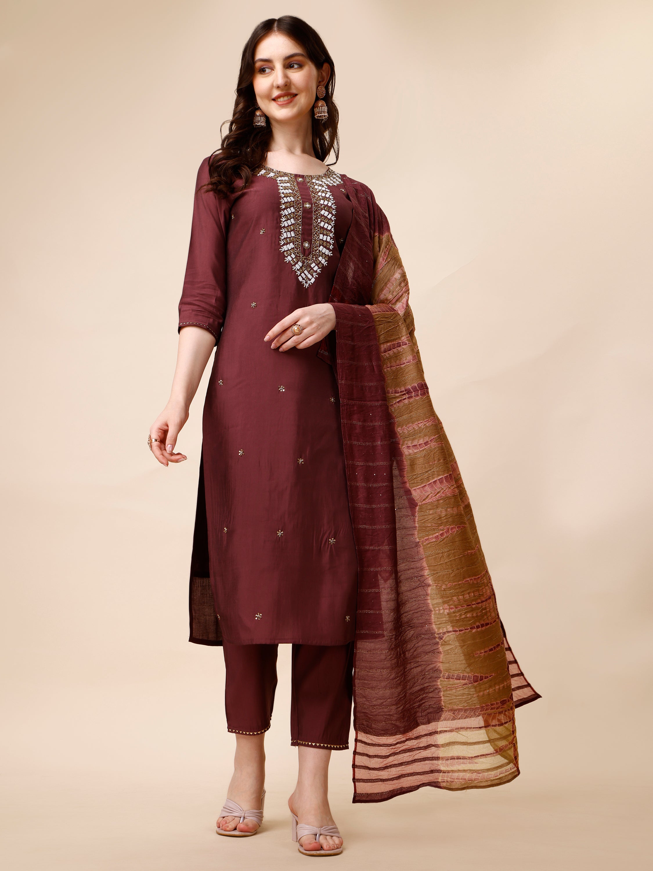 Multicolor hand embroidered rayon kurta paired with matching pants and a dupatta