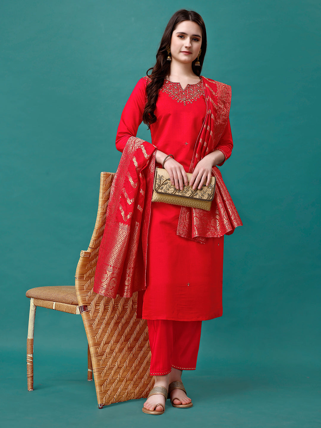 Woman wearing a multicolor hand embroidered kurta set with a Banarasi jacquard dupatta and sweetheart neckline