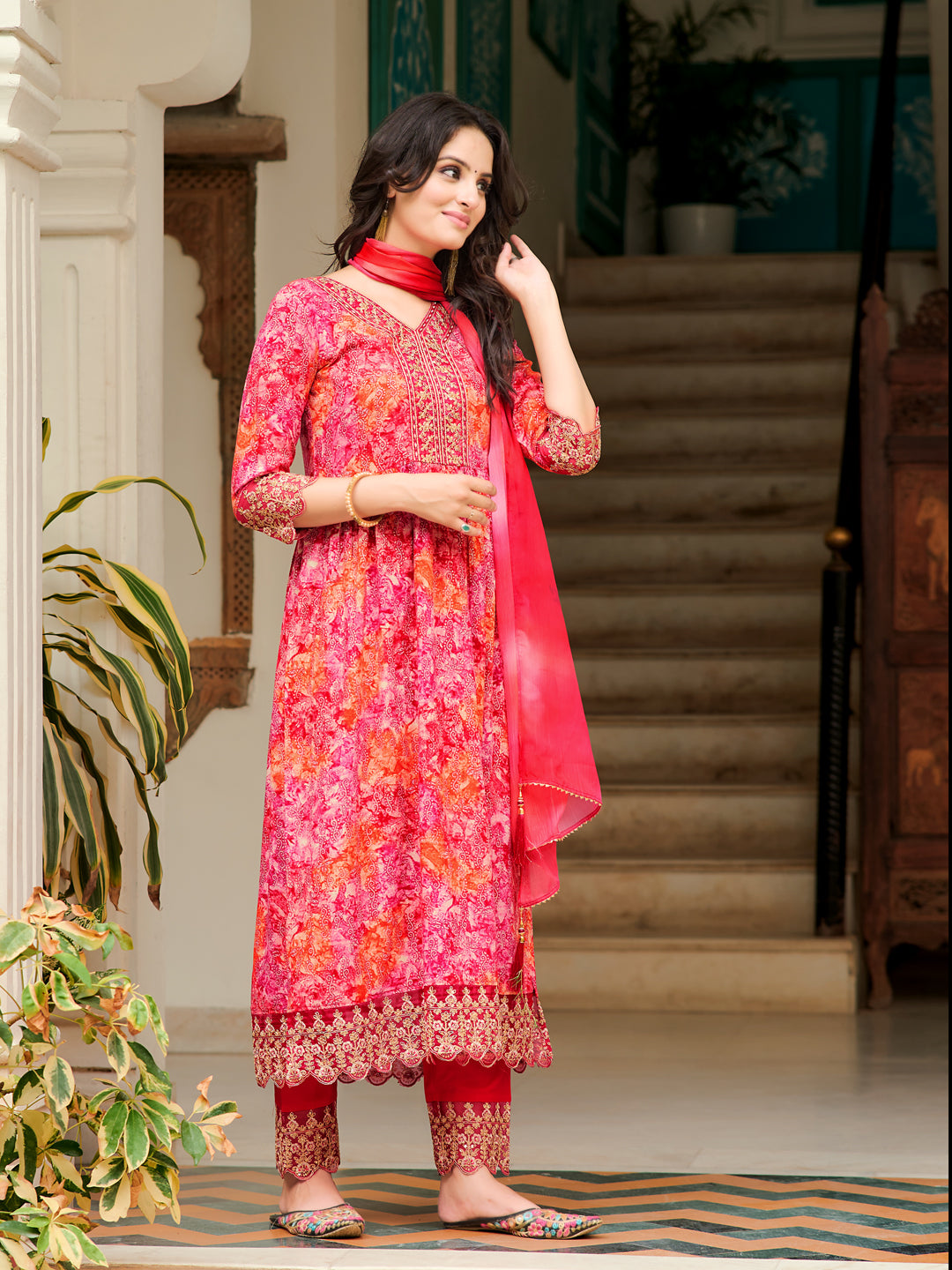 Pink Nyra cut kurta with embroidery and print paired with matching pants and dupatta