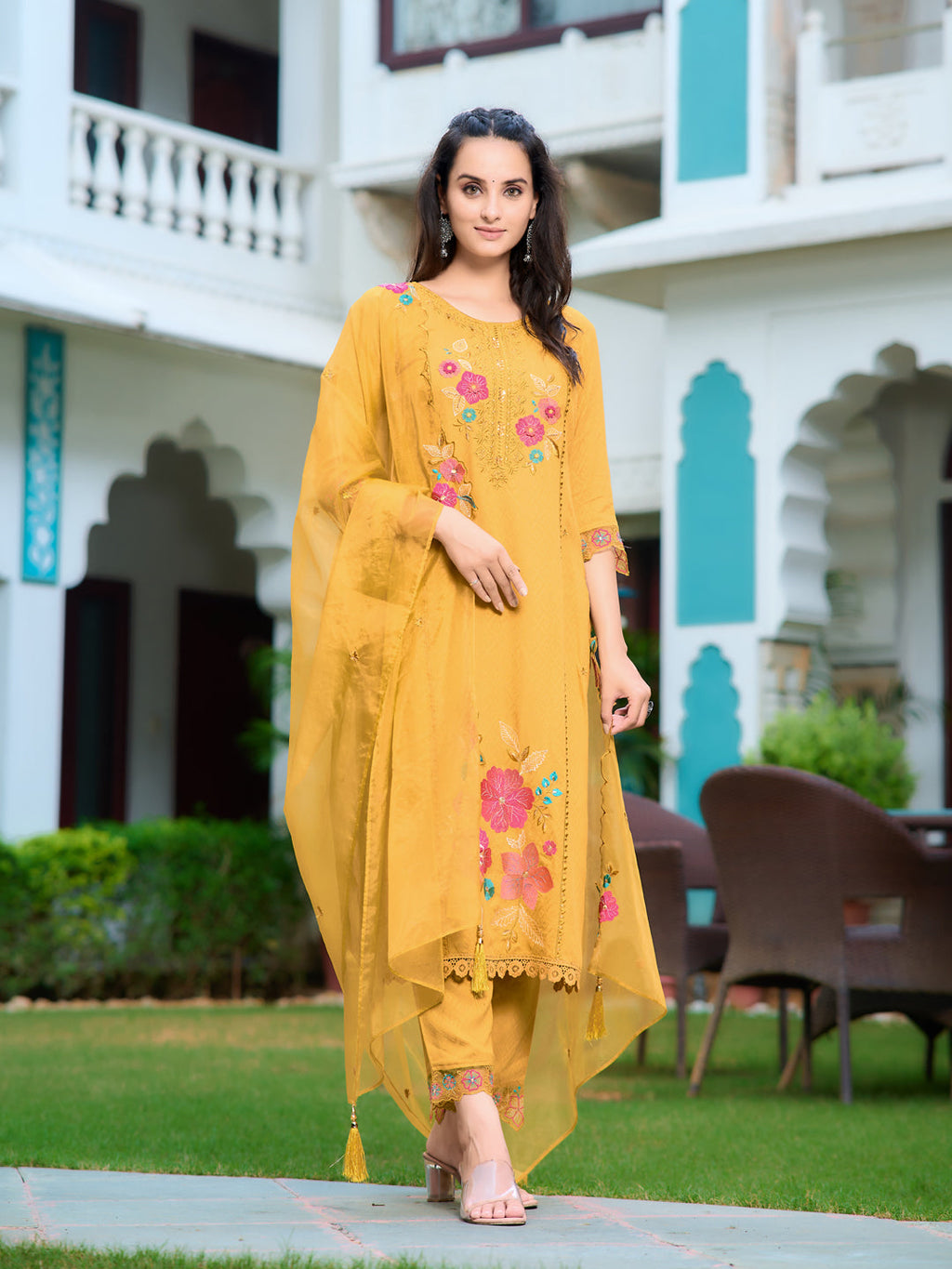 Front view of a vibrant yellow rayon kurta set with embroidery detail and matching dupatta