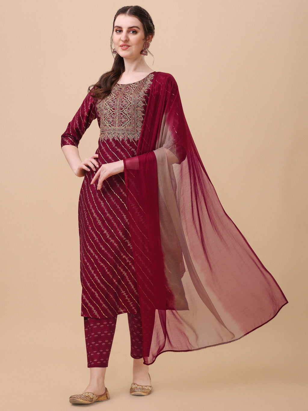 Multicolor Leheriya printed kurta set with matching pants and dupatta on a neutral background