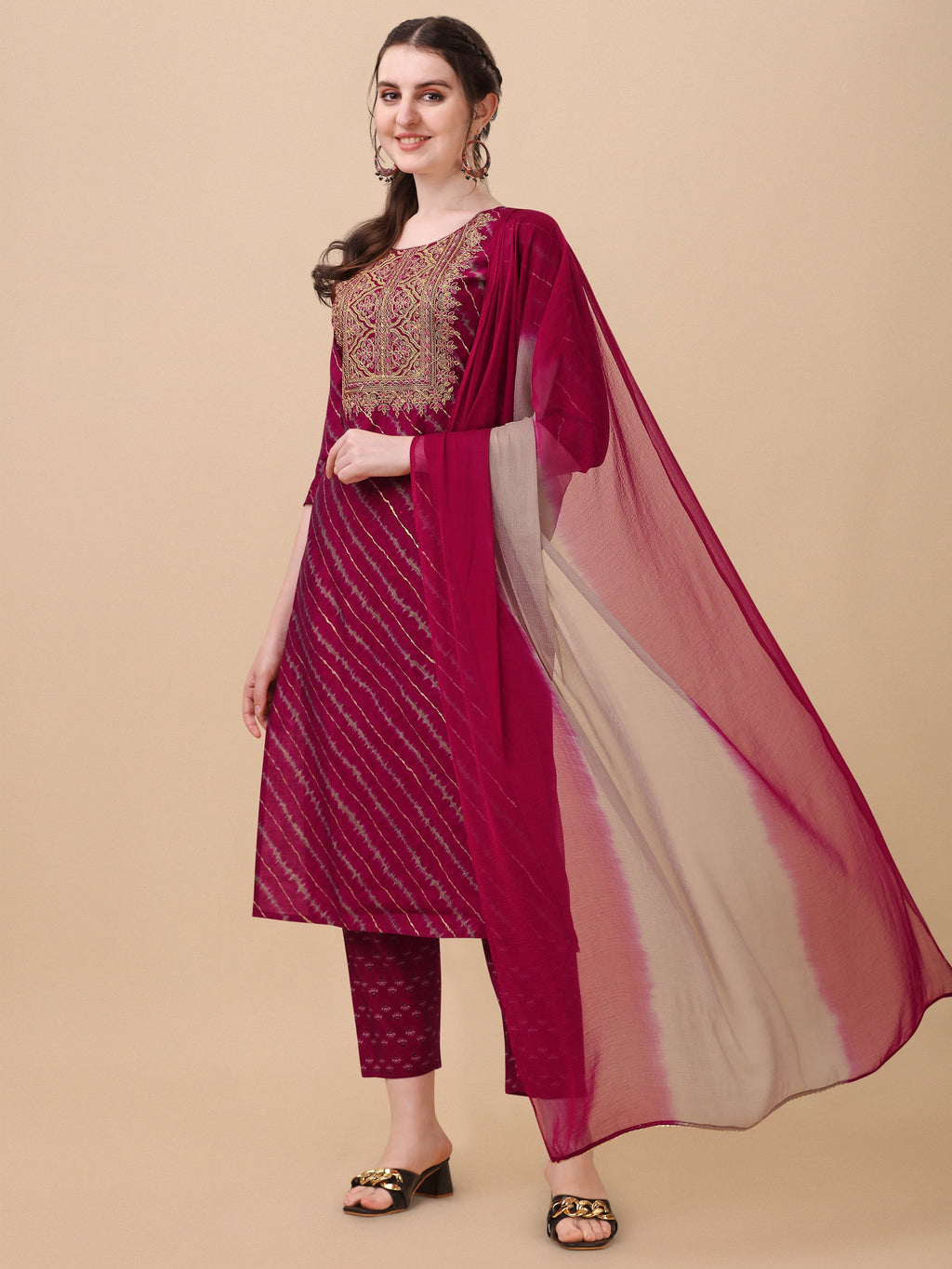 Multicolor Leheriya printed kurta set with delicate embroidery, including pants and a coordinating dupatta.