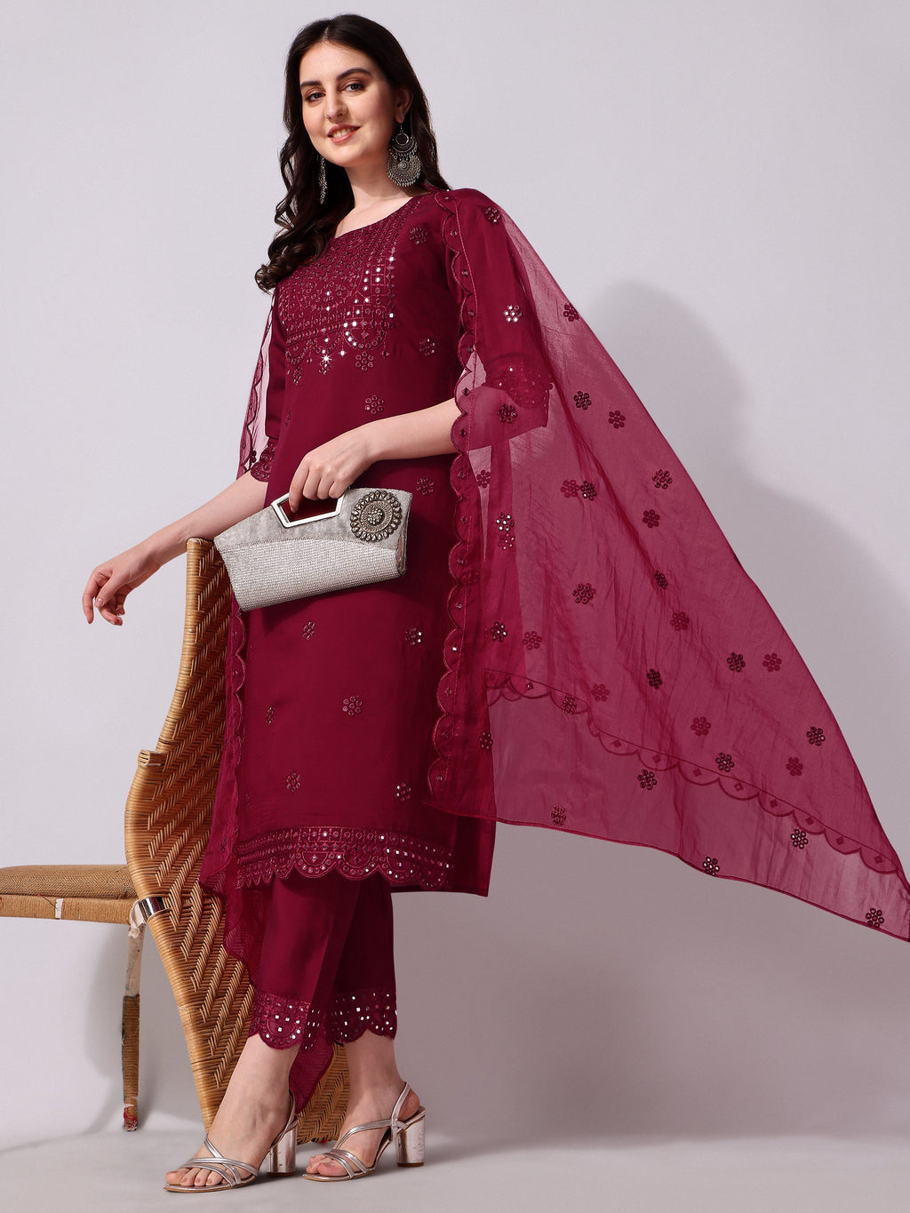 Three-piece multicolor rayon kurta set featuring intricate mirror embroidery with a matching dupatta.
