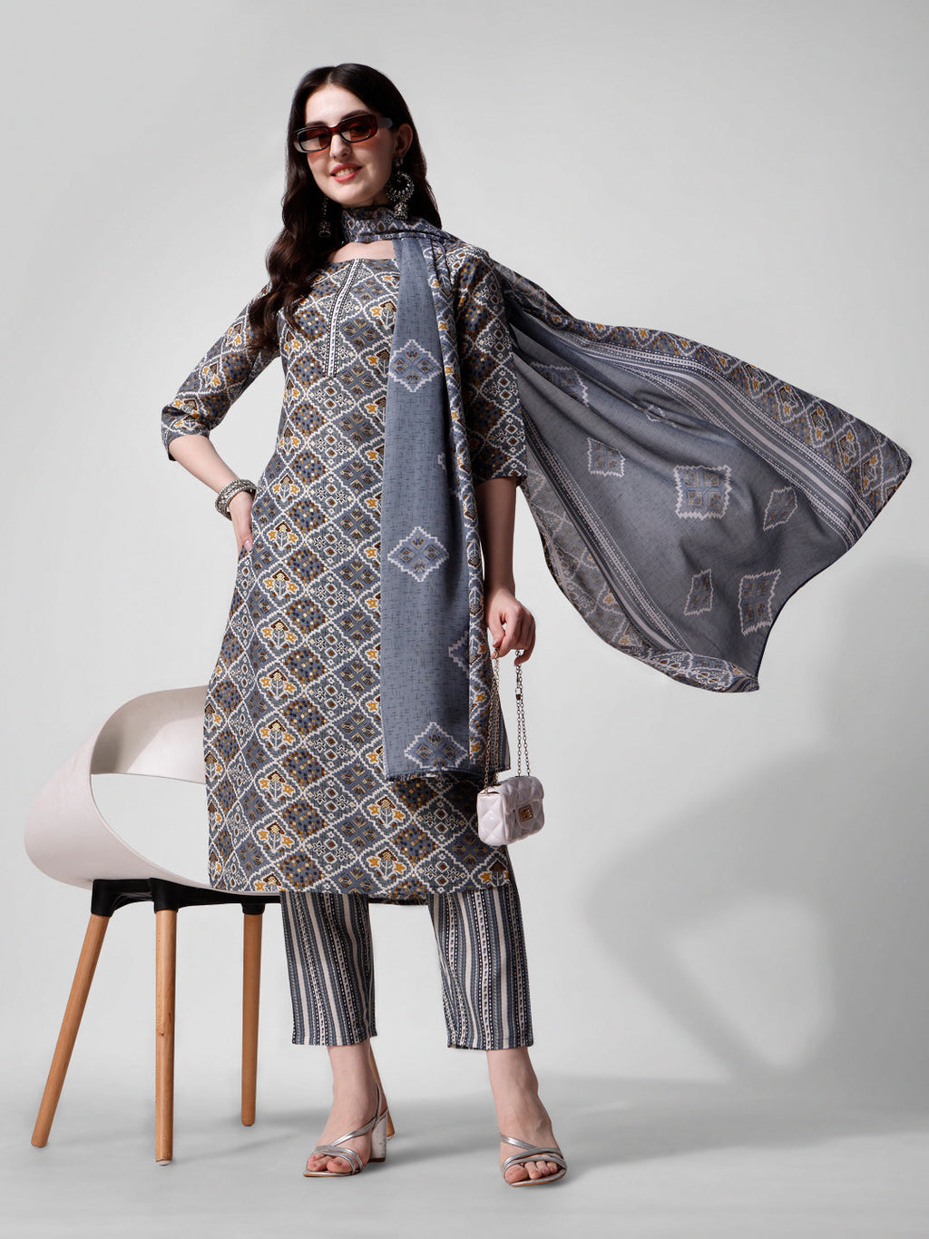 Woman wearing a blue printed rayon kurta pant and dupatta set with 3/4th sleeves