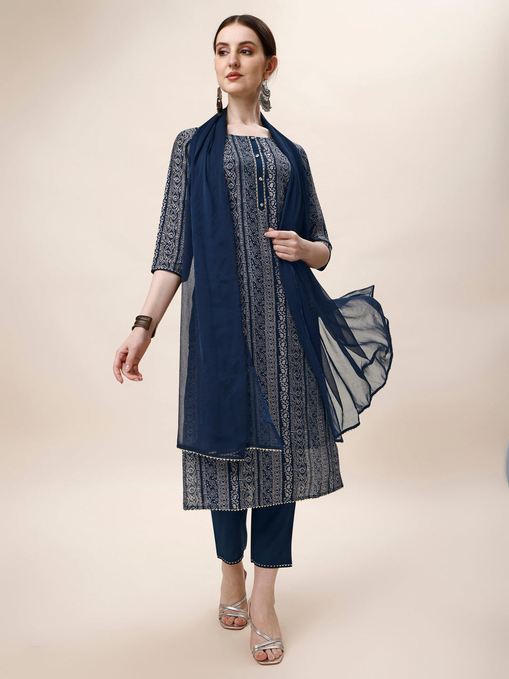 A woman wearing a vibrant multicolor printed rayon kurta set with matching pants and dupatta.