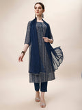 A woman wearing a vibrant multicolor printed rayon kurta set with matching pants and dupatta.