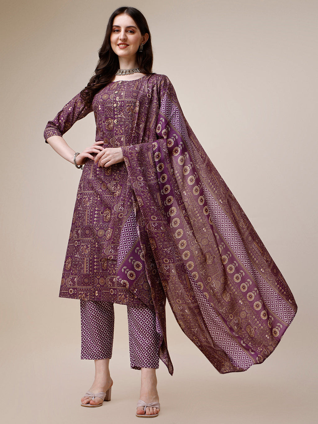 A multicolor printed rayon kurta paired with matching pants and a printed dupatta, featuring 3/4th sleeves and a round neck.