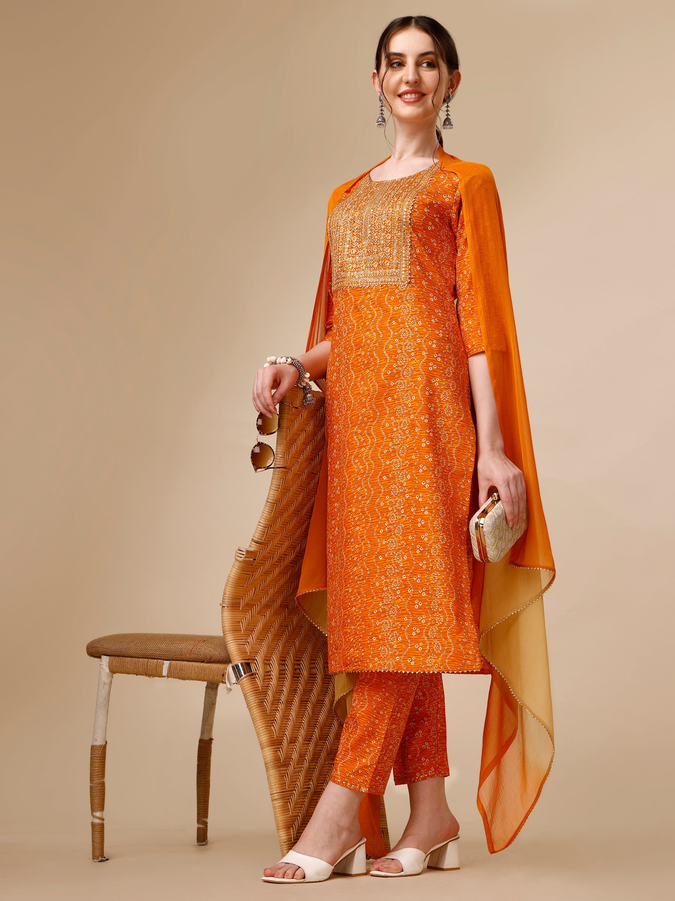 Multicolor Bandhni printed kurta with matching pant and dupatta, featuring embroidery and 3/4th sleeves.