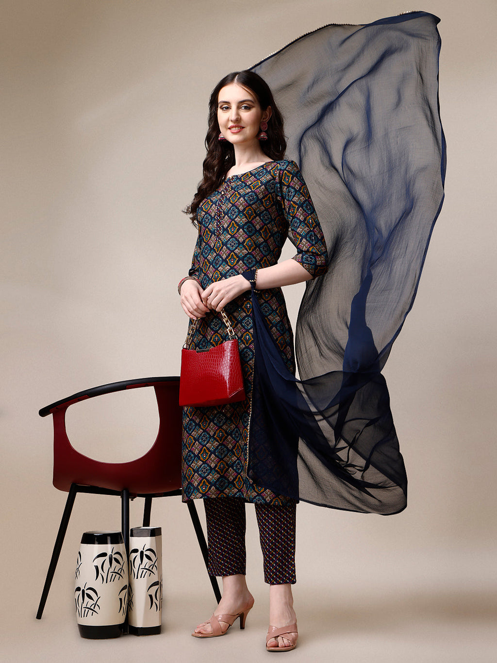 Woman wearing a multicolor printed rayon kurta set with matching pants and dupatta