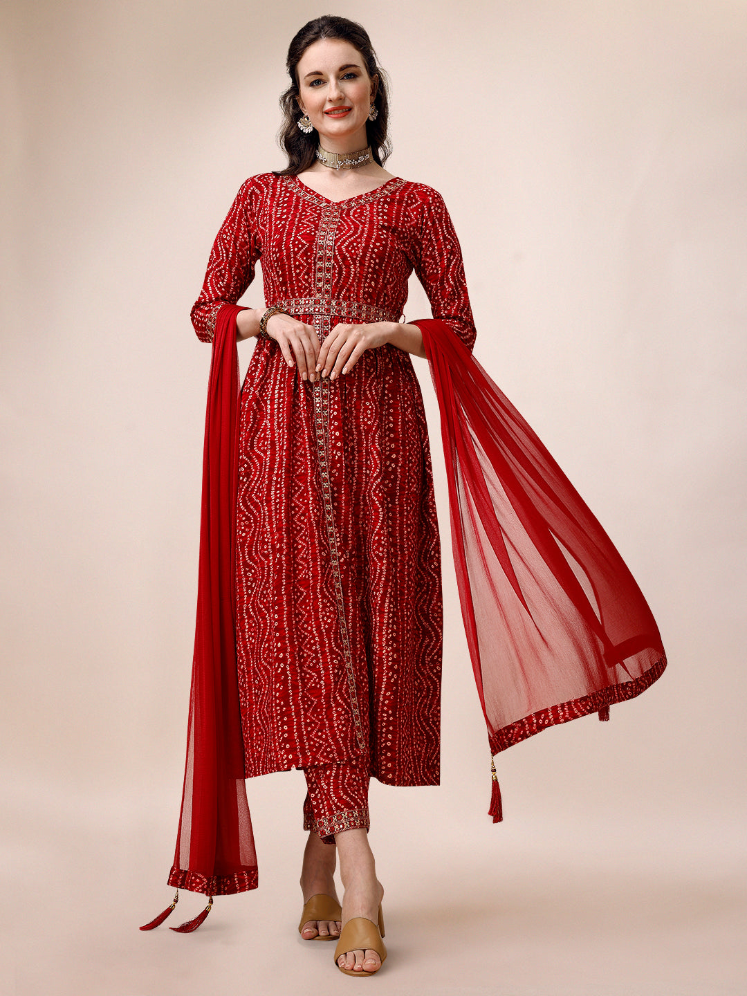 Multicolor Bandhani printed front-slit kurta set with embroidered details, pants, dupatta, and matching belt.