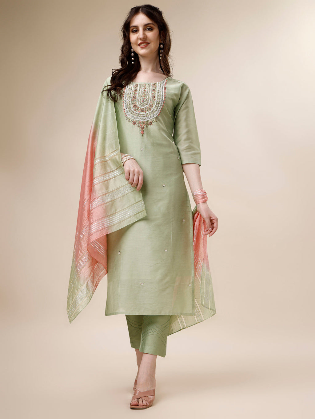 A woman wearing a multicolor embroidered rayon kurta set with matching pants and a dupatta.