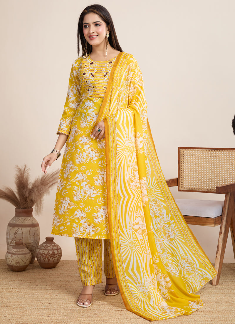 Bright yellow printed cotton blend salwar suit set for festive occasions.