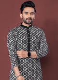 Men's black silk kurta with detailed embroidery and long sleeves