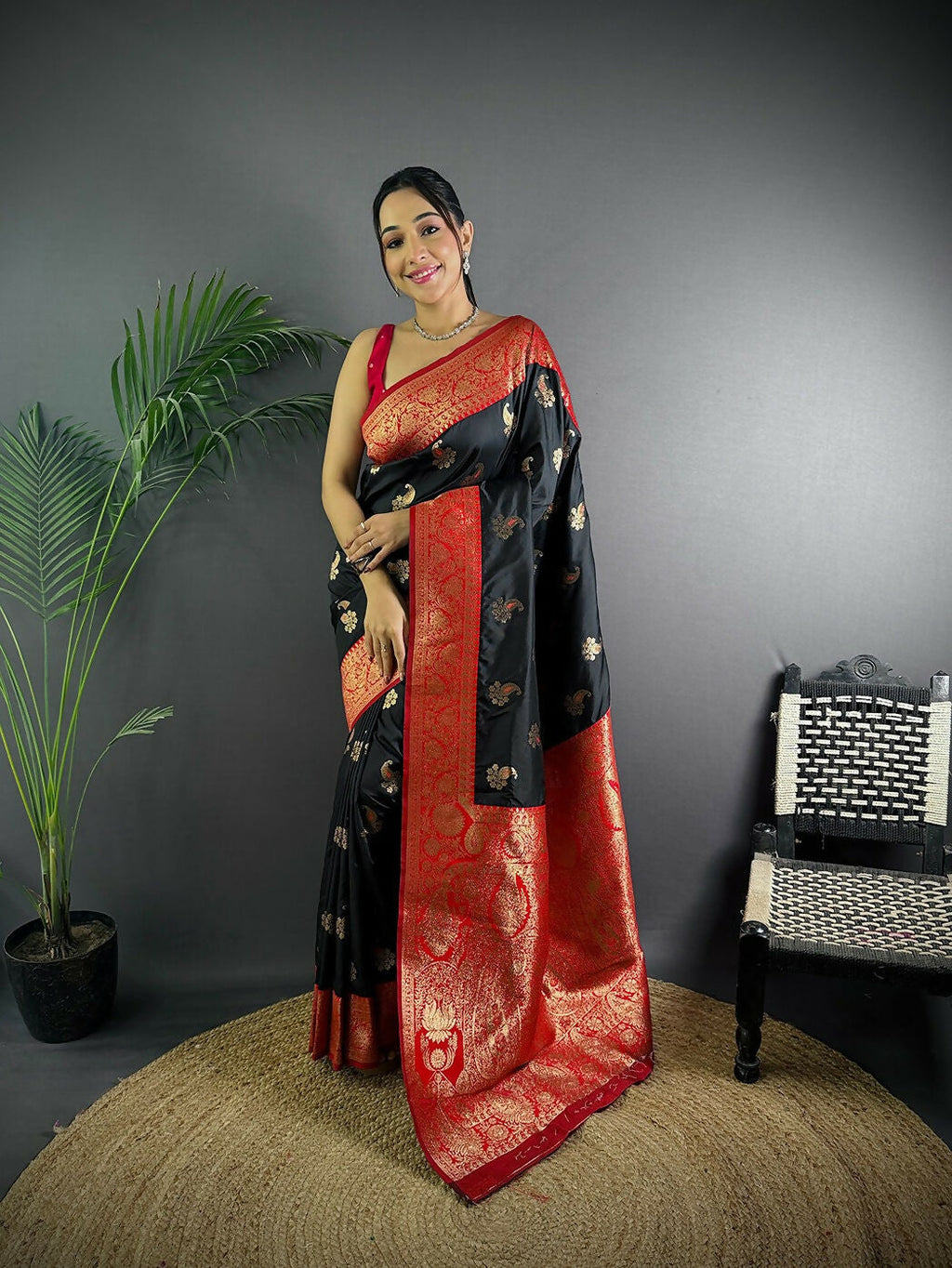 Black Banarasi soft silk saree featuring intricate woven butti patterns