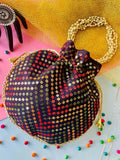 Multicolor geometric print potli bag with drawstring, ideal for ethnic wear and weddings.