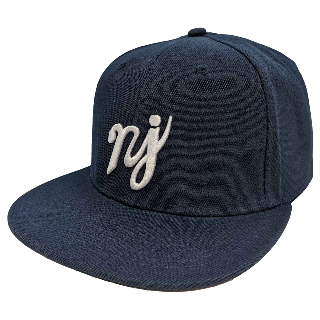A navy blue snapback hat featuring the NJ scripture logo in high-contrast lettering.