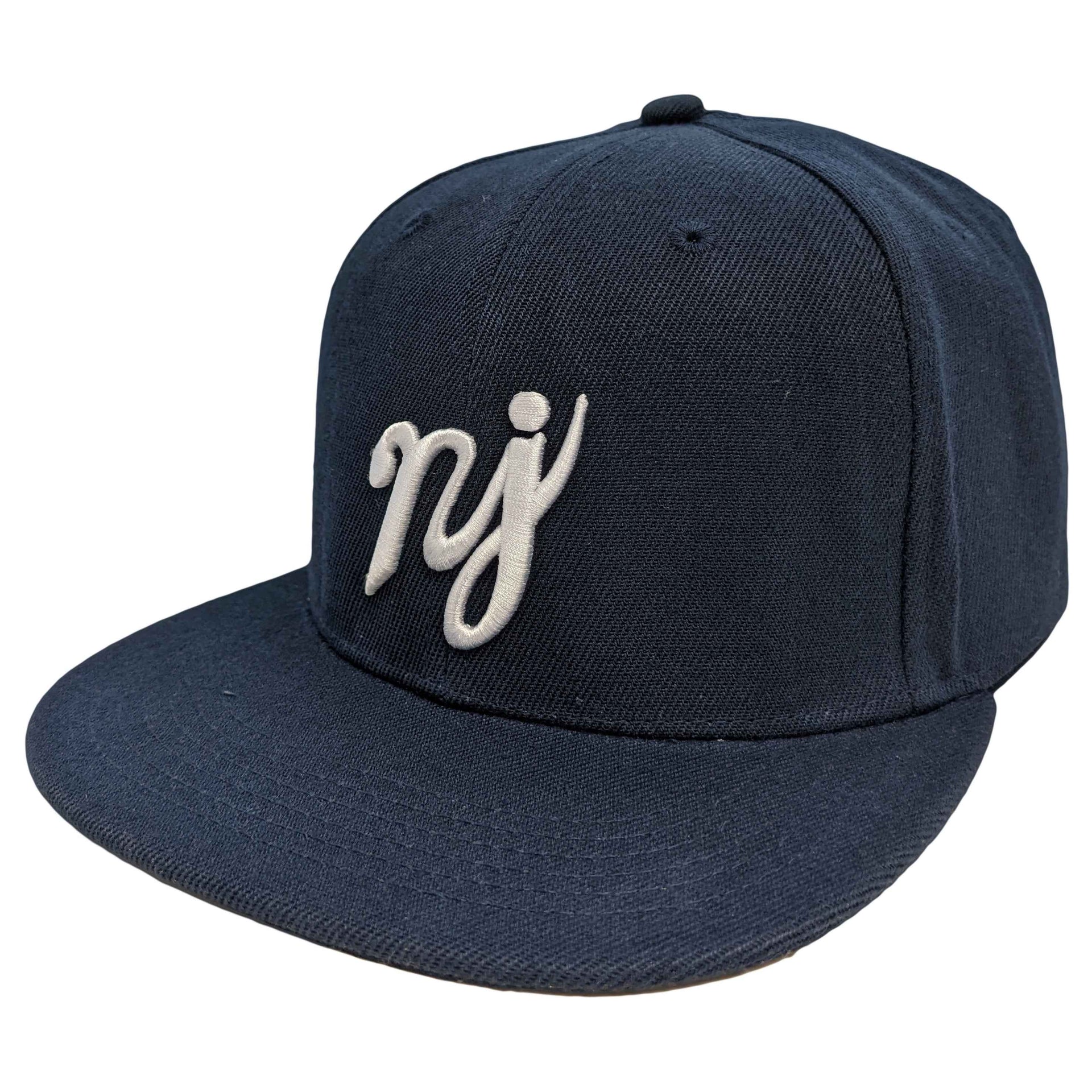 A navy blue snapback hat featuring the NJ scripture logo in high-contrast lettering.