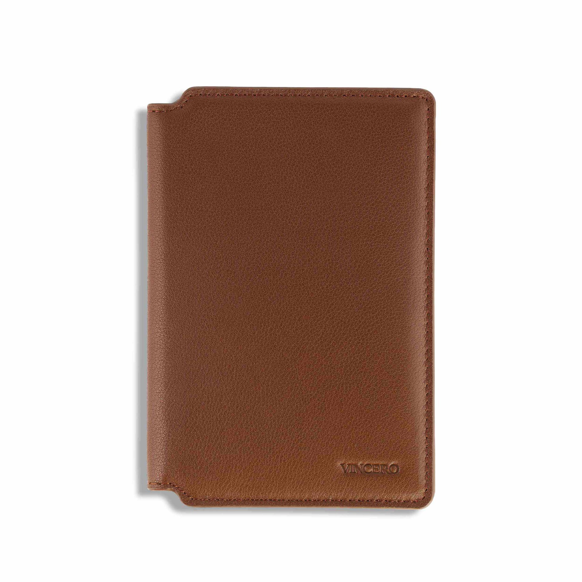 Premium Italian leather passport wallet in Saddle color featuring card slots and document sleeve.