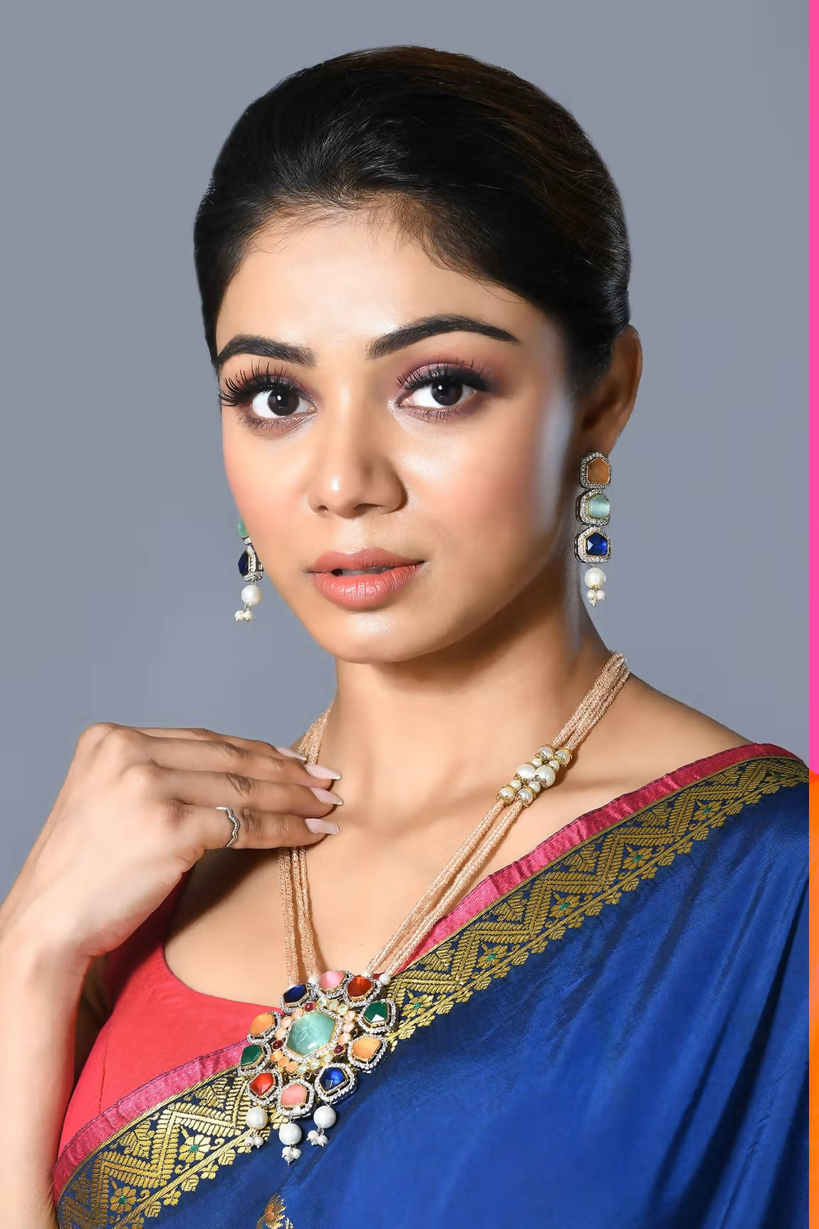 Golden White Jadau Kundan and Pearl pendant set featuring intricate craftsmanship and elegant drop earrings.
