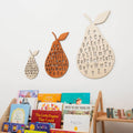 Minimalist beige and brown wood ABC alphabet wall decor with a pear-themed design