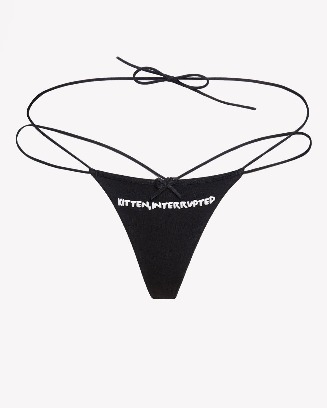 Close up of Kitten, Interrupted strappy black and white G-string with graphic text