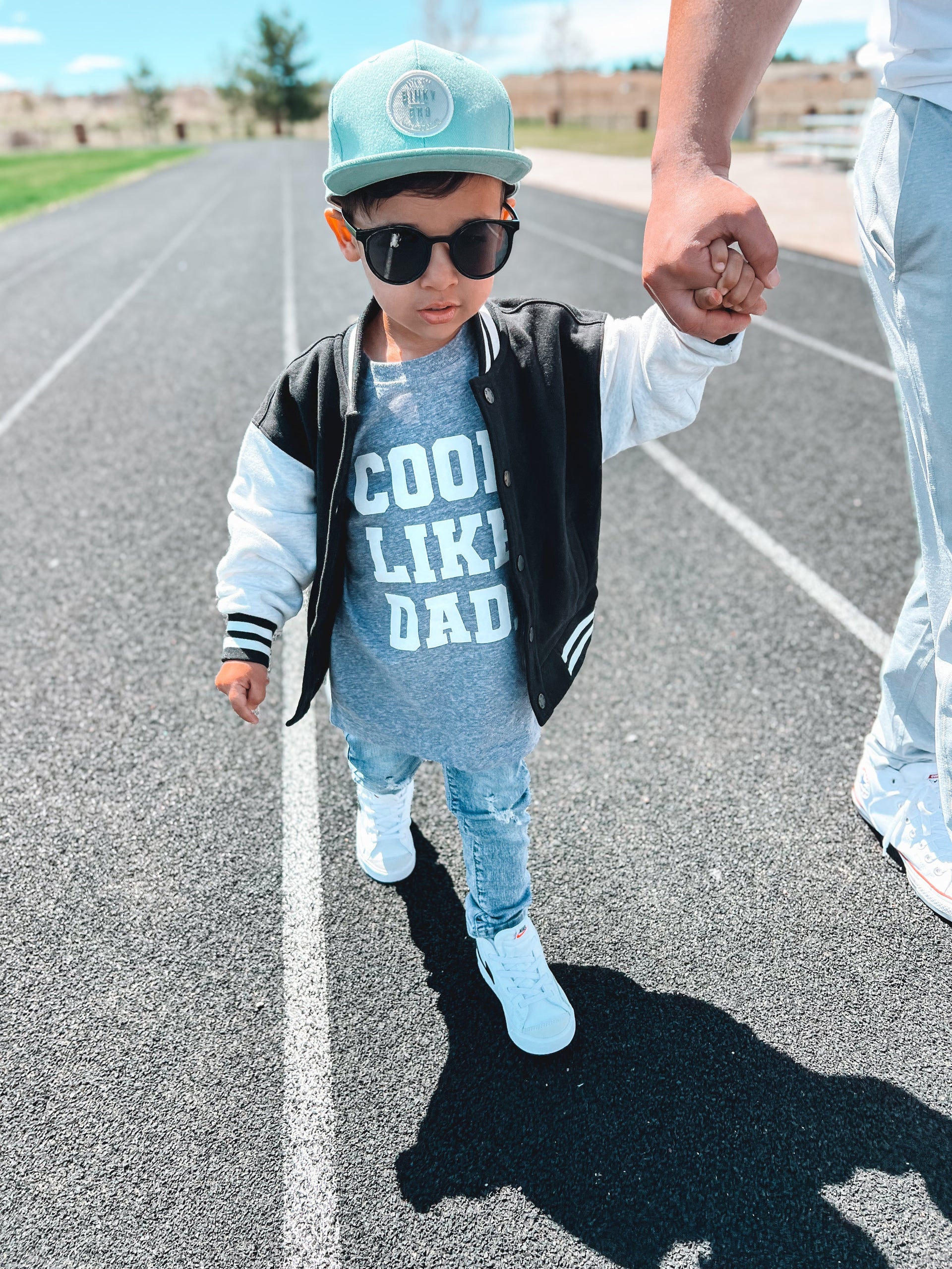 Cool Like Dad graphic tee available in grey, black, cream, and peach colors.