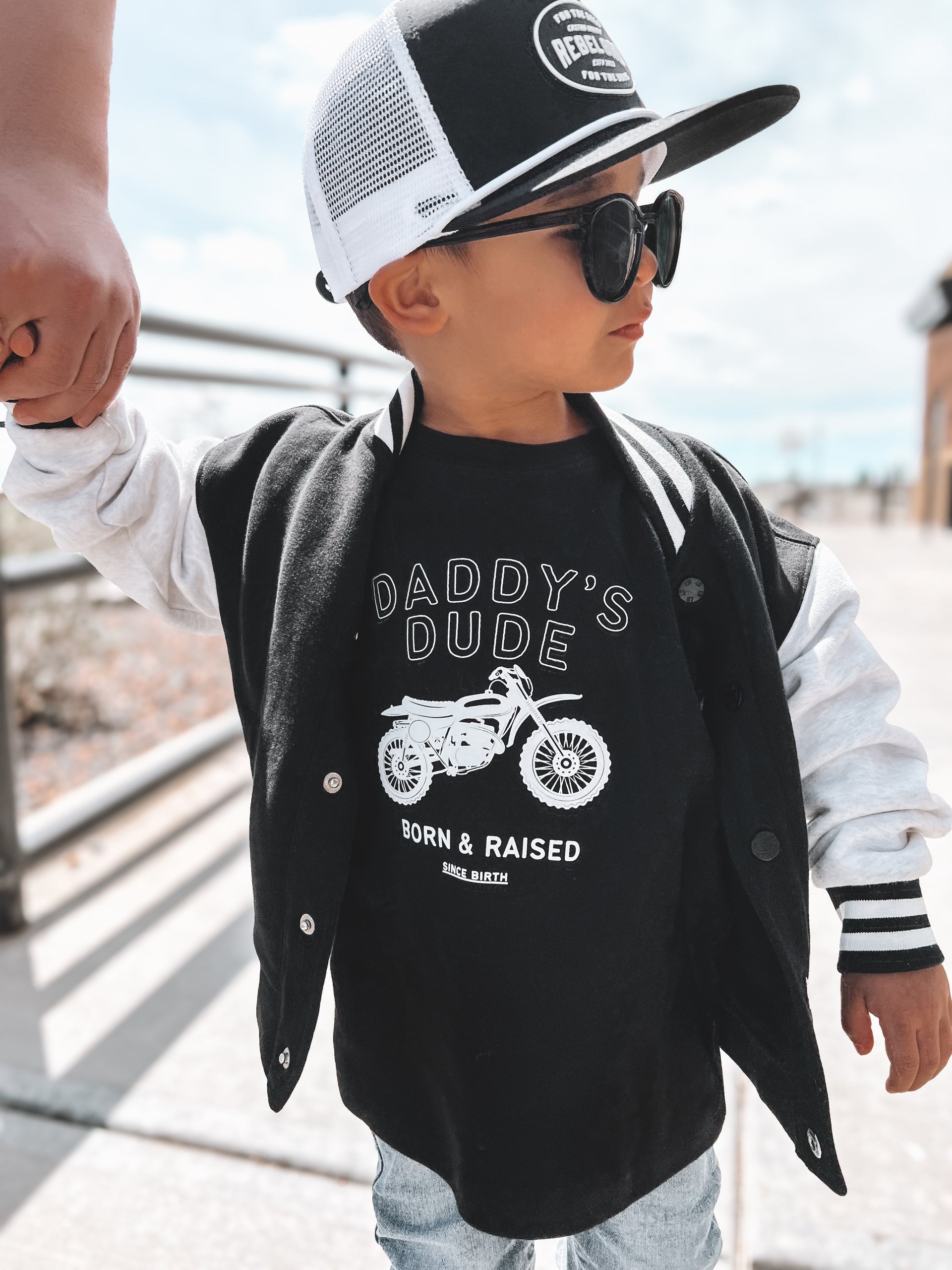 Kids wearing Daddy's Dude Born & Raised graphic crewneck tee in black and white