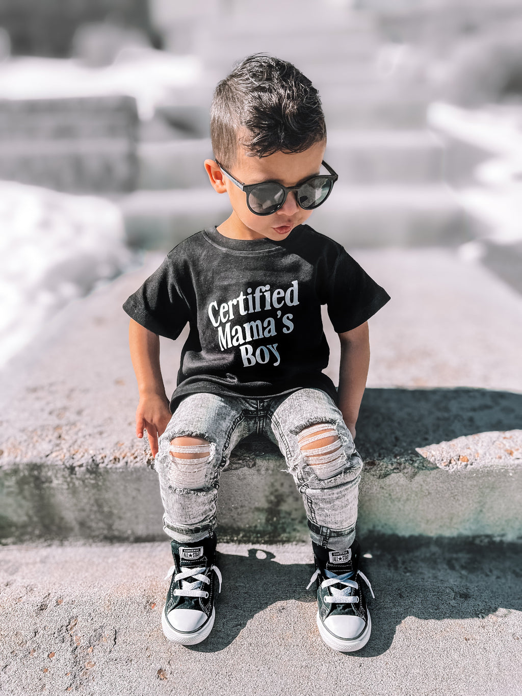 Kids wearing a minimalist black or white Certified Mama's Boy crewneck t-shirt