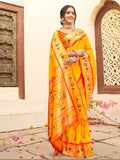 Vibrant yellow silk blend saree with contrast orange blouse for festive wear