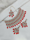 Vibrant red stone work necklace set with matching tikka and earrings