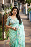 SeaGreen pure linen saree featuring intricate pencil stitch embroidery and heavy silk blouse