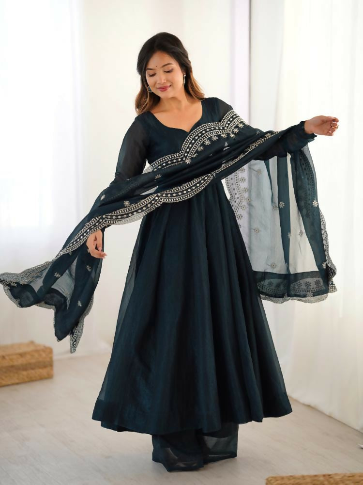 A beautiful blue Chinnon Silk kurta set featuring detailed sequence embroidery work.
