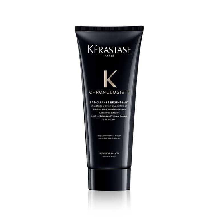 Luxury black tube of Kérastase Chronologiste Pré-Cleanse Régénérant with gold branding