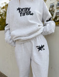 Close up of Pray First Unisex Sweatpants with Philippians 4:6-7 scripture design