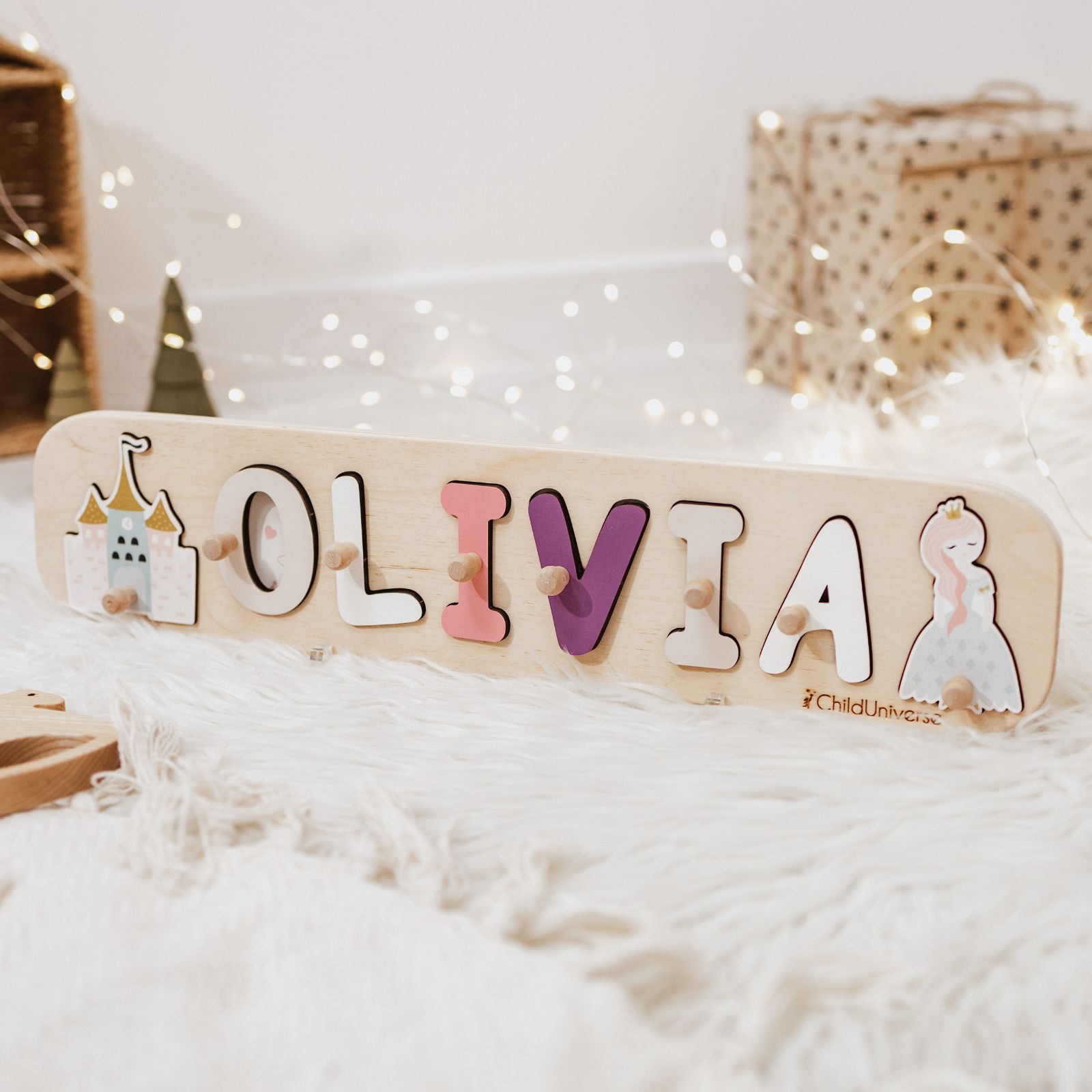 Personalized wooden princess name puzzle for toddlers on a white background