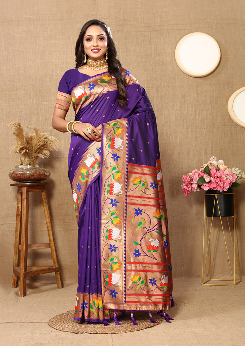 Purple soft Paithani silk saree with detailed gold zari meenakari weaving and traditional border.