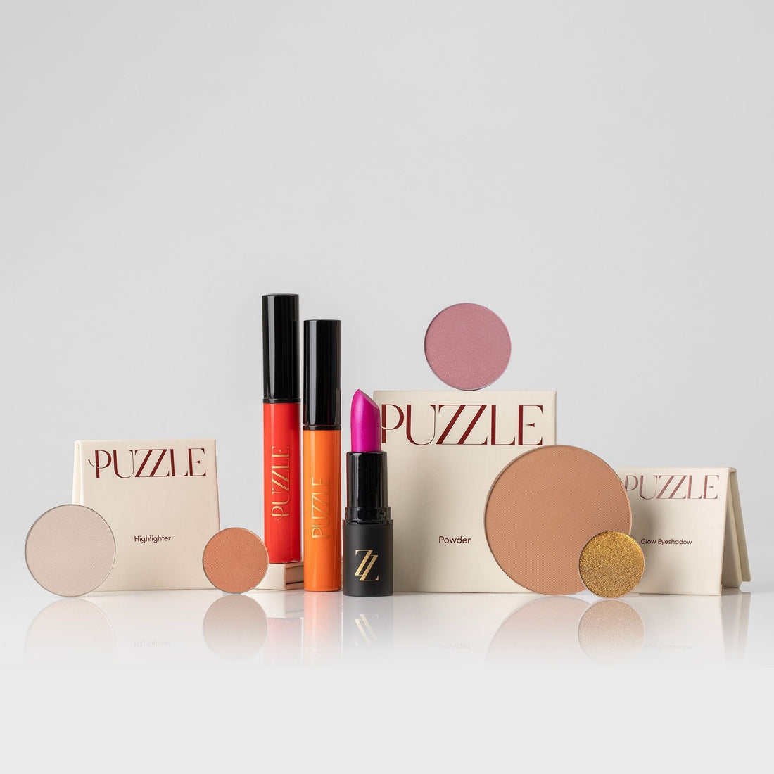 The Essentials Set featuring glow eyeshadow, powder, and highlighter.