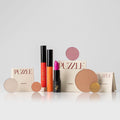 The Essentials Set featuring glow eyeshadow, powder, and highlighter.