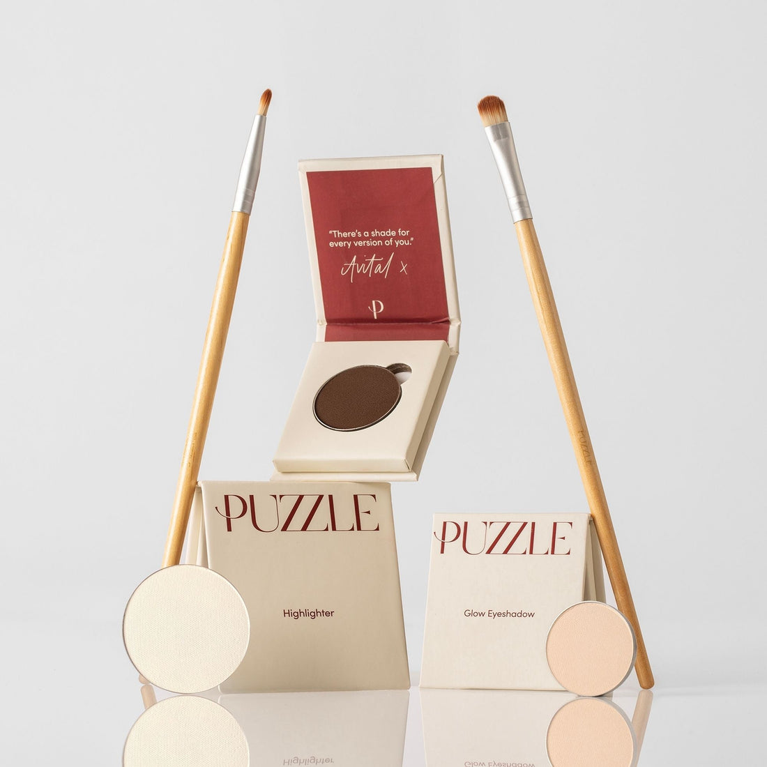 The Eye-Lift Kit featuring cream, brown, champagne, and beige eyeshadow shades in a minimalist compact.