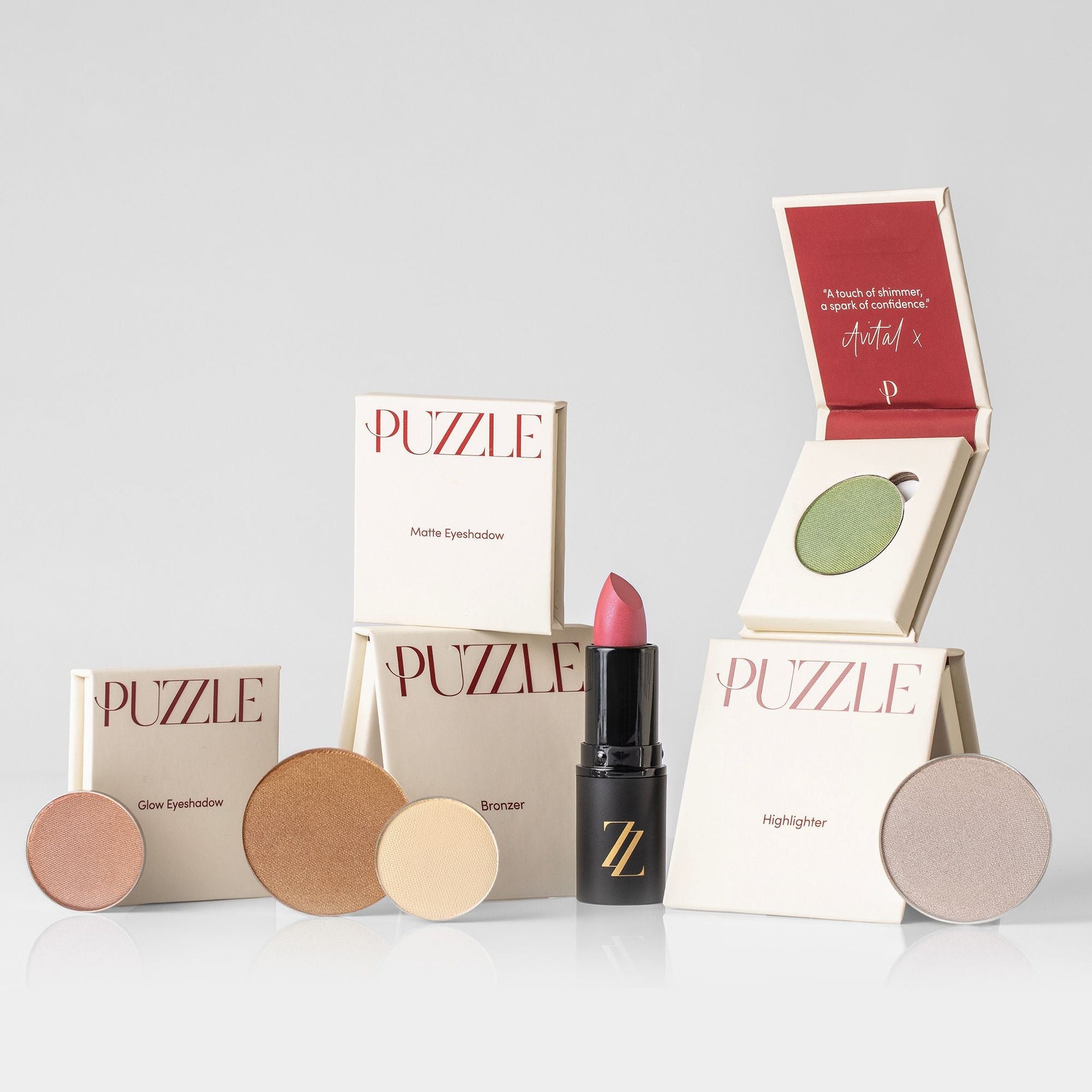 The Romance Edition palette featuring pink, green, gold, and beige shades with highlighter and bronzer.