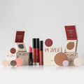 The Rule Breakers Set featuring eyeshadows, blush, and highlighter in nude, pink, red, and lavender tones.